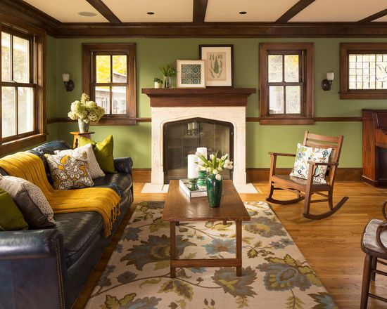 a living room filled with furniture and a fire place in front of a fireplace surrounded by windows