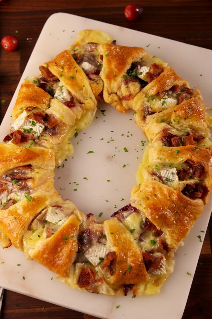 a pastry wreath sitting on top of a cutting board