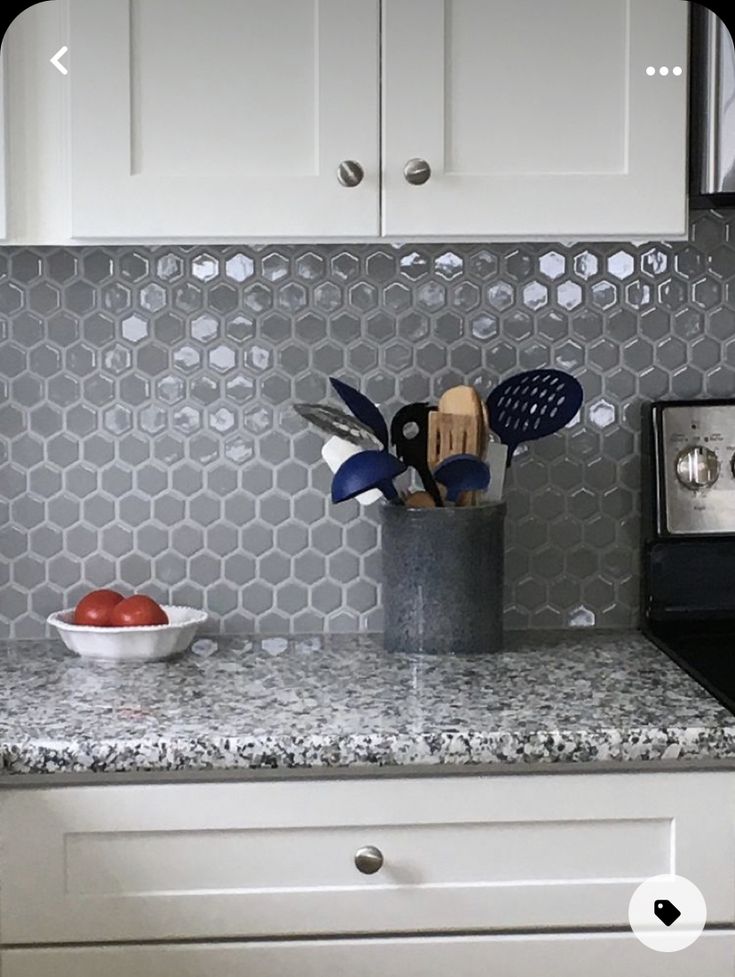 the kitchen counter is clean and ready to be used as a utensil holder