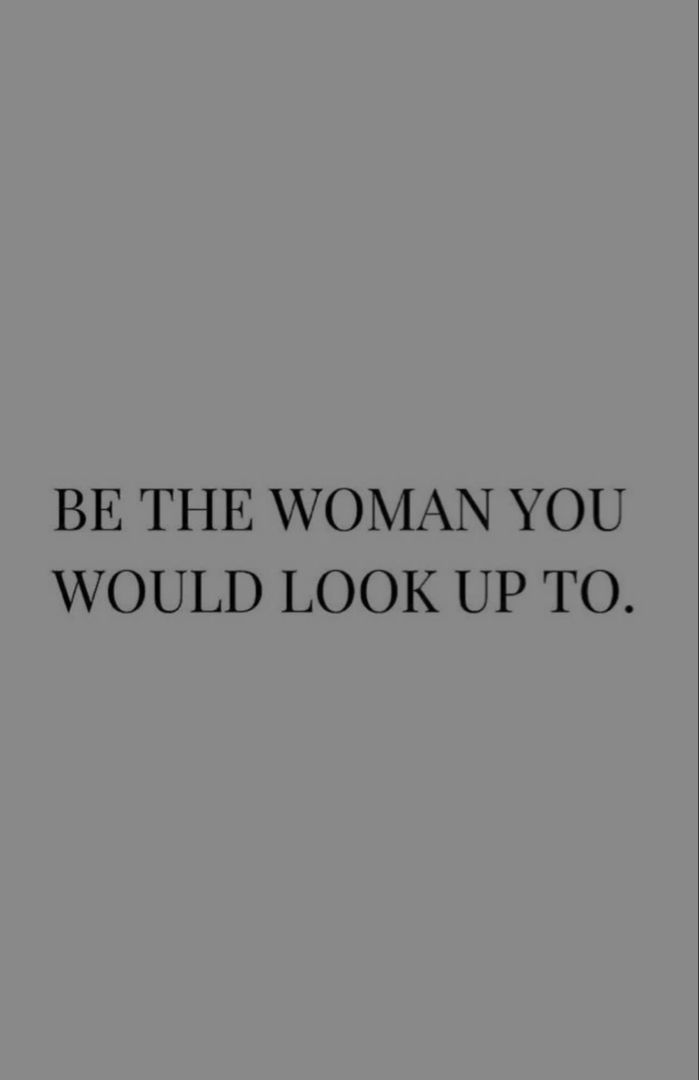 the words be the woman you would look up to are in black and white on a gray background