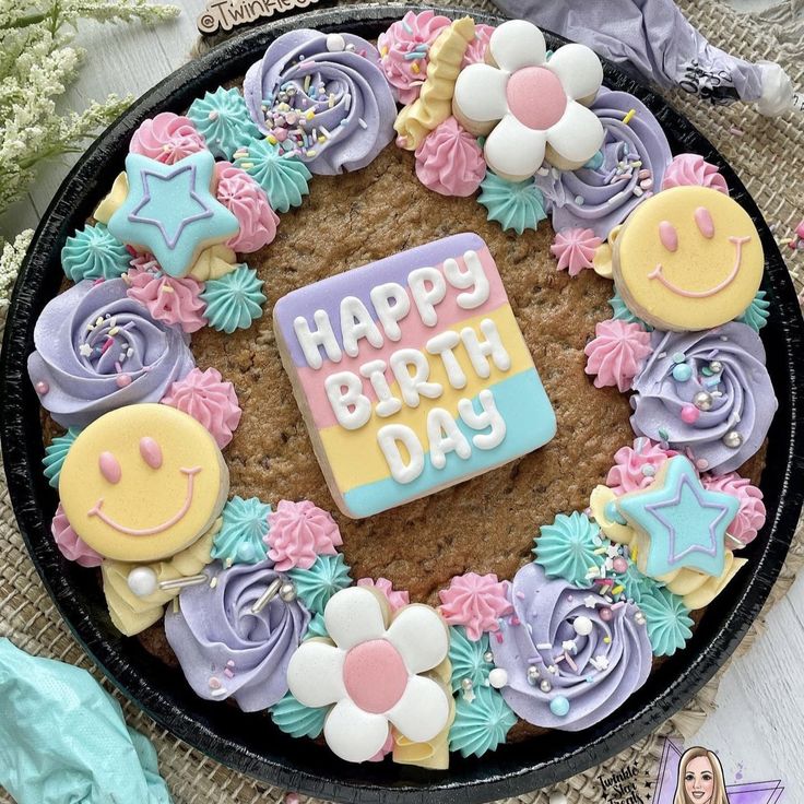 a birthday cake decorated with cookies and decorations