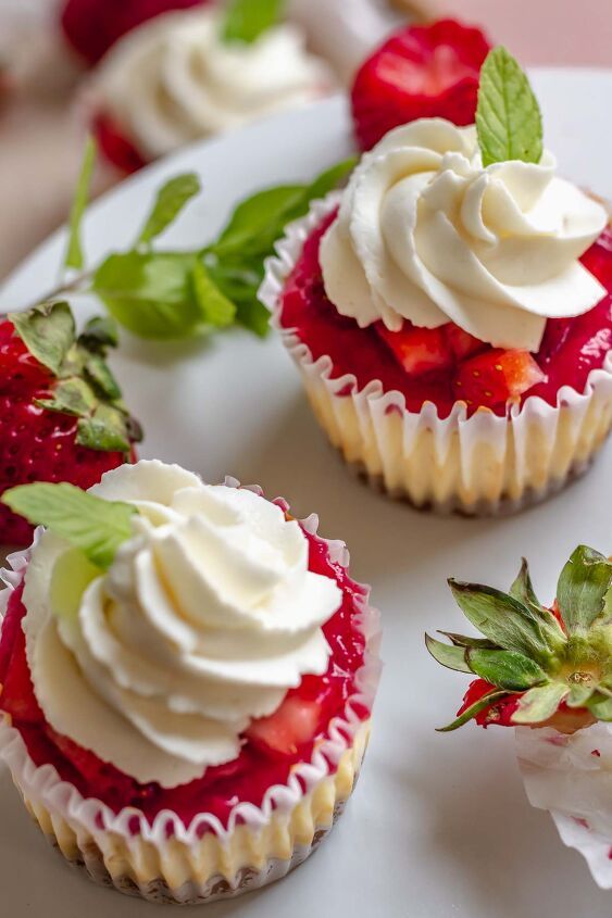 strawberry cupcakes with whipped cream and fresh strawberries