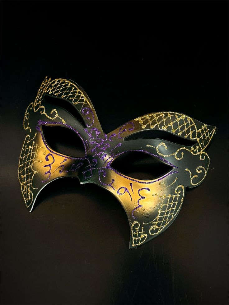 This exquisite mask embodies the festive spirit with its vibrant colors of purple, green, and gold. Whether you're heading to a masquerade ball, a Mardi Gras celebration, or simply looking to add a touch of extravagance to your evening, this mask is your perfect choice.


Age Group/Gender - Adult/Men

Size/Type - One size fits all adults

Mask Color - Black/Gold

Mask Material - Polyresin Mardi Gras Masks And Prosthetics, Green Eye Mask For Masquerade, Green Masquerade Mask For Mardi Gras, Mardi Gras Costume Eye Mask, Green Masquerade Mask For Mardi Gras Party, Multicolor Masks For Masquerade Carnival, Venetian Masquerade Mask For Mardi Gras Costume Party, Venetian Masks For Mardi Gras Costume Party, Green Masks For Masquerade Carnival