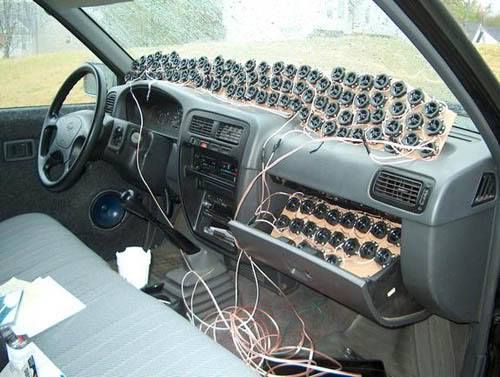 the interior of a car with many electronic devices in it