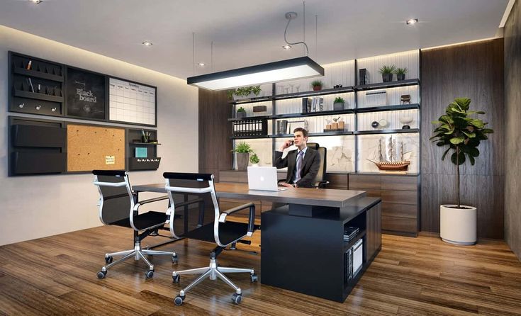 a man sitting at a desk in an office