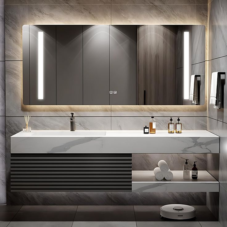 a modern bathroom with two sinks and large mirrors on the wall above it is illuminated by lights