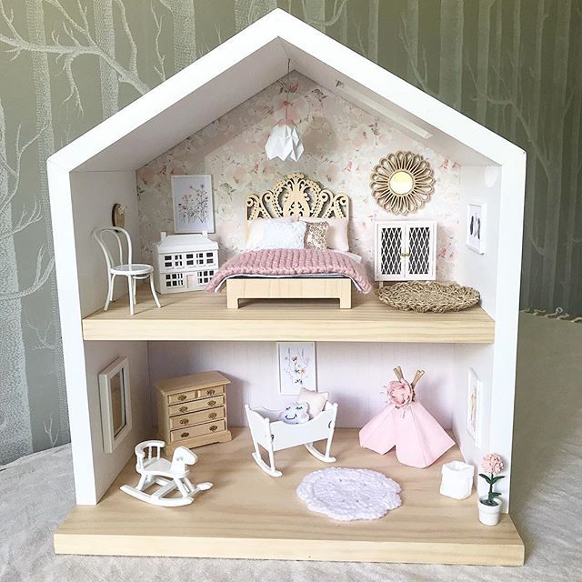 a doll house with furniture and accessories in it