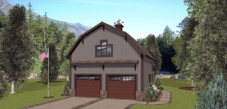 a two car garage with an american flag on the side and trees in the background