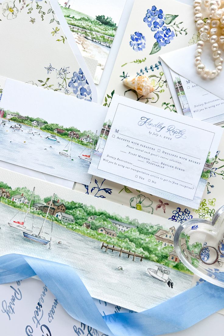 the wedding stationery is laid out and ready for guests