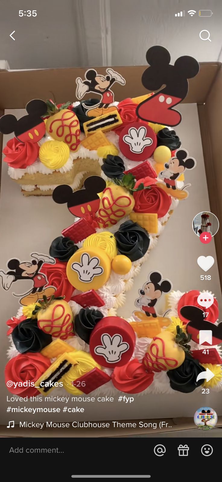 a box filled with mickey mouse cupcakes on top of a table