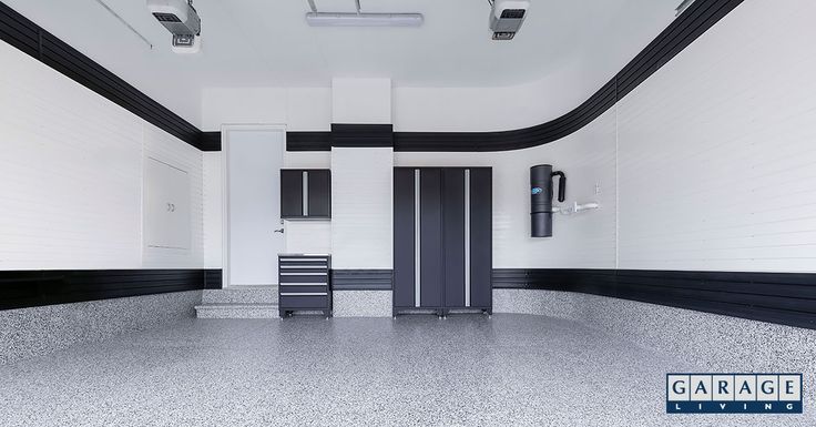 an empty room with white walls and black trim on the ceiling, two doors are open