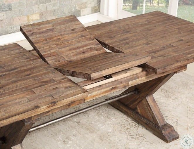 a wooden table sitting in front of a window with two pieces of wood on it