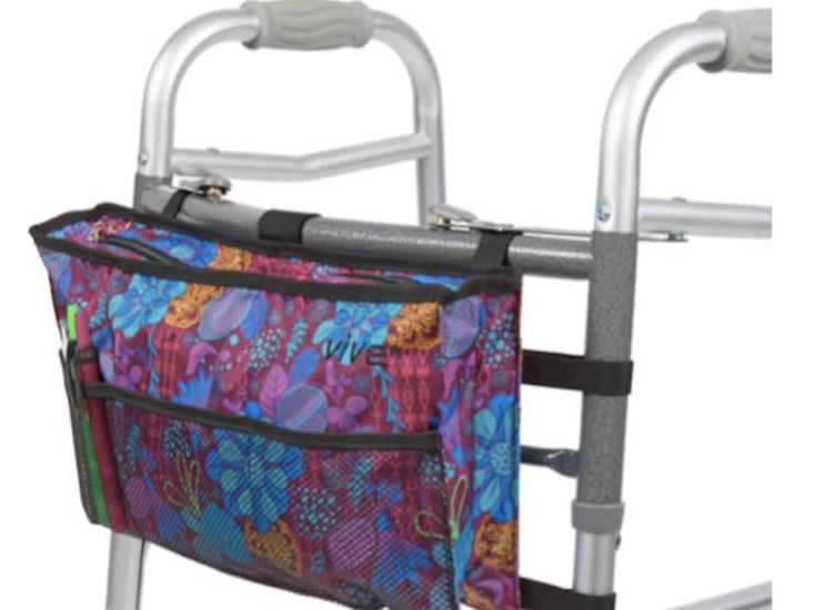 a walker with a colorful flowered bag on it