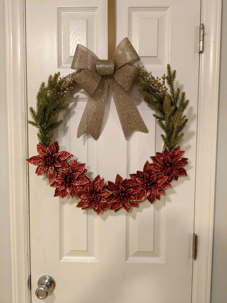 a christmas wreath hanging on the front door