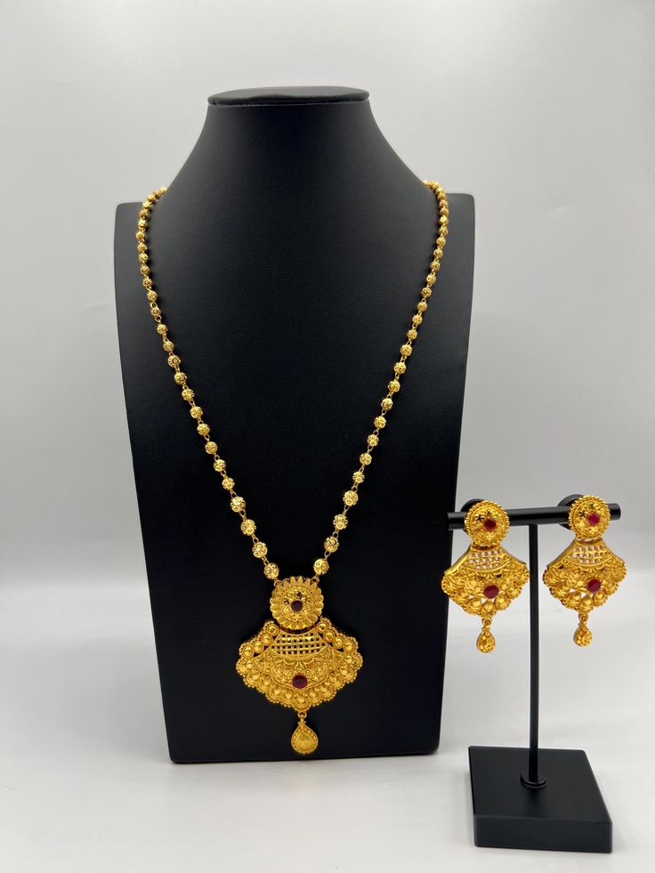 Elevate your traditional attire with our exquisite Gold Plated Ball Chain Rani Haar Set. This stunning piece is a perfect blend of elegance and sophistication, designed to make you shine at any special occasion. Care Instructions  To maintain its shine and quality, avoid direct contact with water, perfumes, and other chemicals. Store in a dry place. Gold Kundan Filigree Necklace For Diwali, Yellow Gold Jewelry Sets With Latkans For Festive Occasions, Festive Yellow Gold Jewelry Sets With Latkans, Traditional Gold Plated Chain Necklace For Festive Occasions, Festive Gold-plated Jewelry Sets For Puja, Gold Plated Yellow Gold Bridal Necklace For Puja, Elegant Necklaces For Eid Puja, Gold Bridal Necklace Hand Set, Gold Kundan Jewelry Sets For Eid