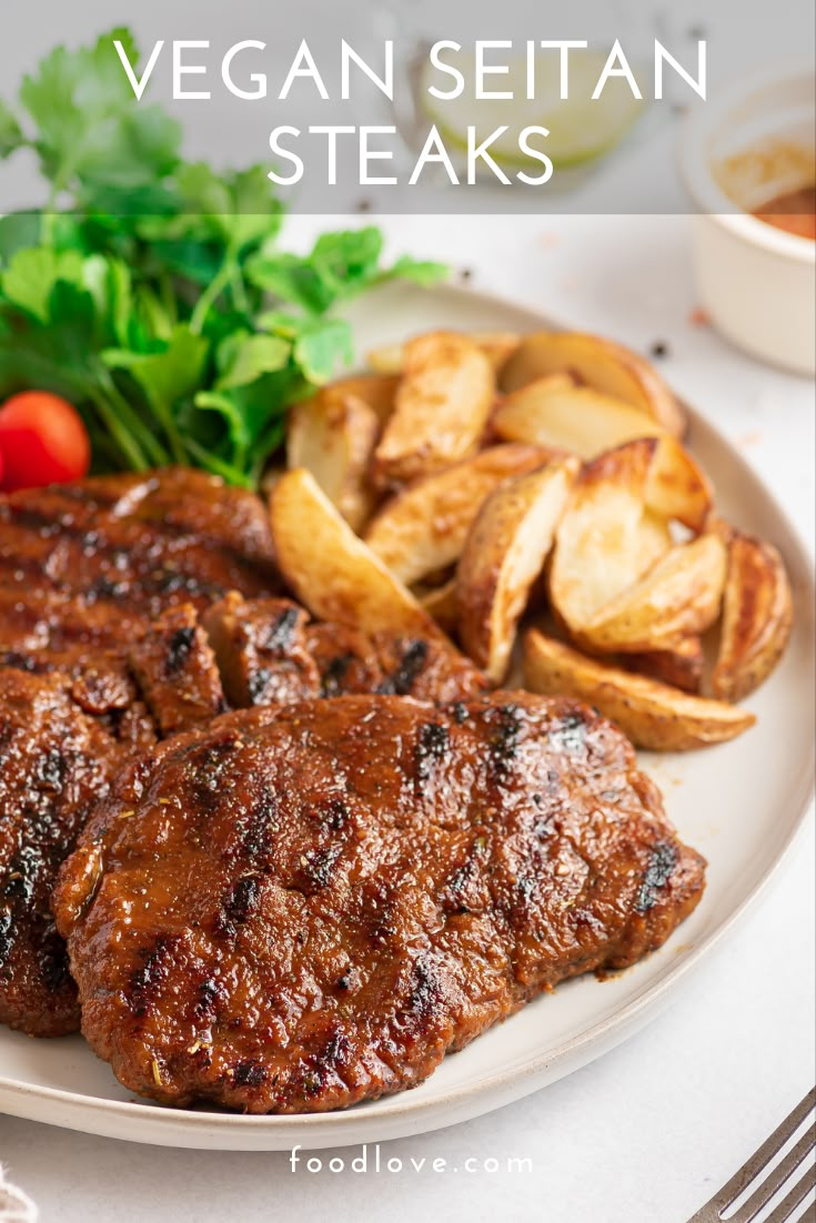 a plate with steak, potatoes and lettuce on it