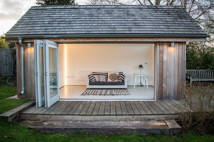 an outdoor living area with a couch in it