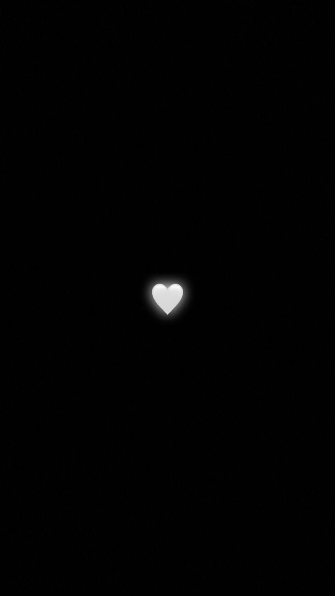 a heart shaped object in the dark sky