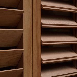 a wooden shelf filled with lots of drawers