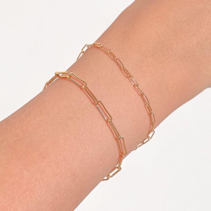 A delicate gold paperclip bracelet. Wear on its own or layer with our Figaro bracelet. This paperclip bracelet makes for the perfect layering piece. BUY 2, GET 1 FREE. Coupon applied at checkout. - Width: 2.5 mm. - Adjustable chain 6 to 8 in.- Shower safe / Tarnish resistant / Hypoallergenic- Made in gold vermeil: a thick 18k gold layer on sterling silver- 1 Year warranty Elegant Gold Plated Paperclip Chain Bracelet, Gold Paperclip Bracelet For Everyday, Gold Paperclip Everyday Bracelet, Modern Gold Plated Paperclip Chain Bracelet, Delicate Gold Paperclip Bracelet For Everyday Wear, Everyday Gold Plated Paperclip Bracelet With Oval Link, Gold Plated Minimalist Paperclip Bracelet, Dainty 14k Gold-filled Paperclip Bracelet For Everyday, Dainty 14k Gold Filled Paperclip Bracelet For Everyday