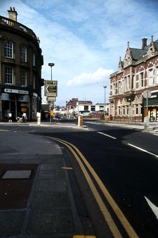 an empty street with buildings on both sides