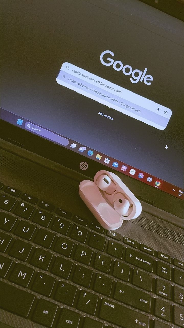 an open laptop computer sitting on top of a desk next to a mouse and keyboard