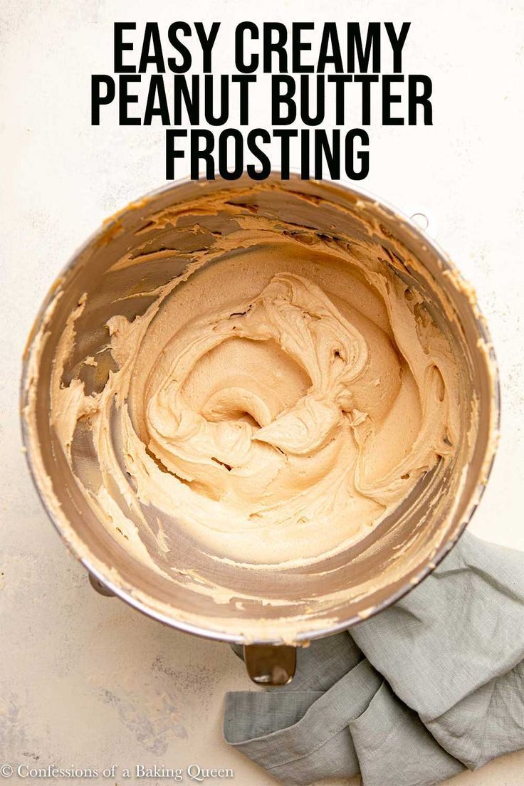 a metal bowl filled with peanut butter frosting