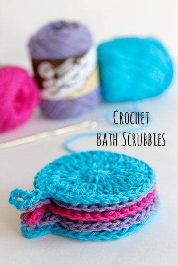 three crochet bath scrubbles sitting next to each other