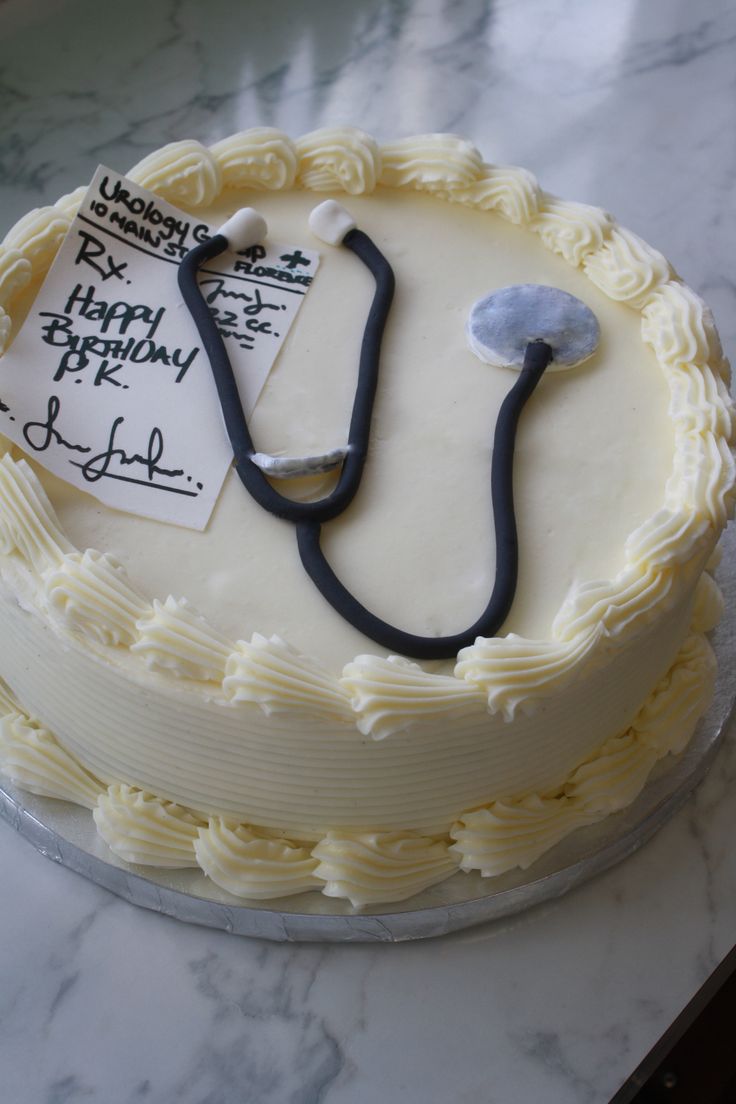 a cake with a stethoscope on top of it sitting on a table