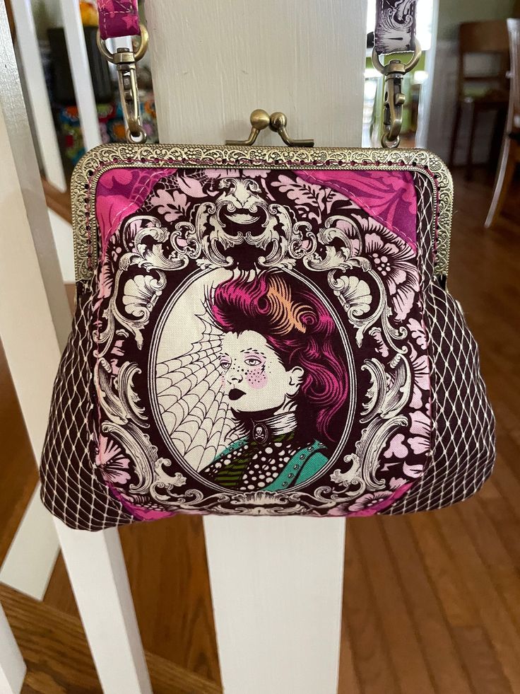 a purse with an image of a woman's face on it