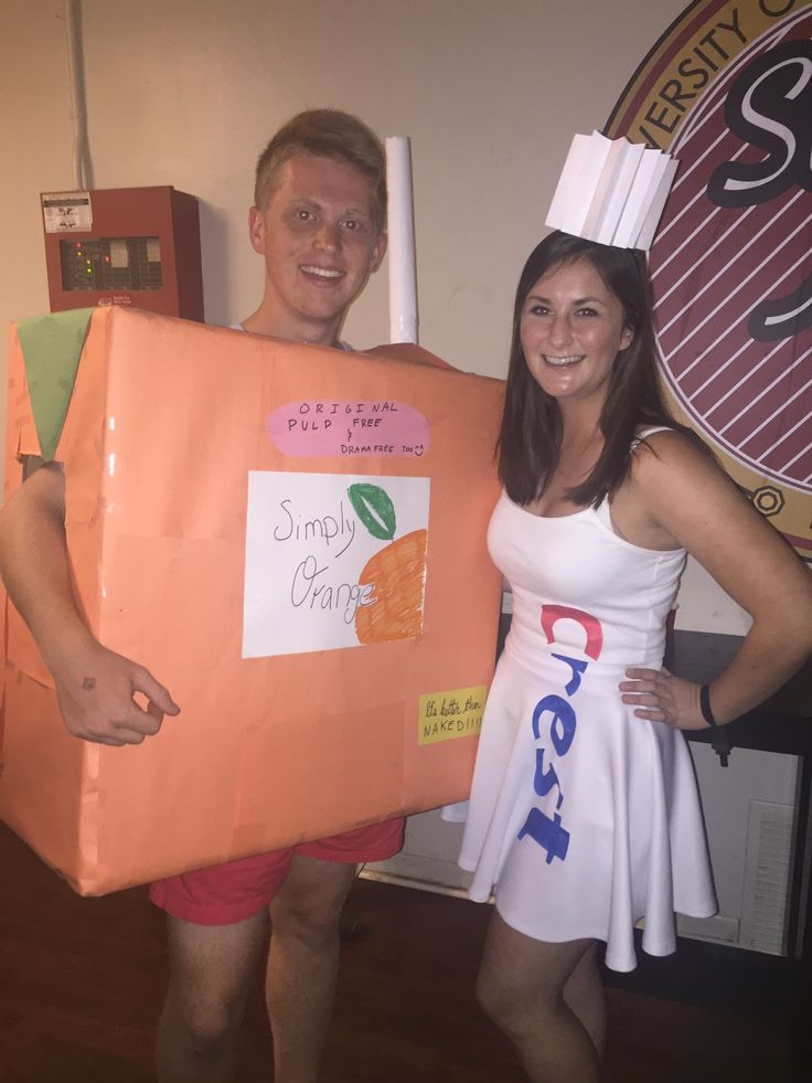 a man and woman dressed up in costumes holding an orange box with the words smurp gravy written on it