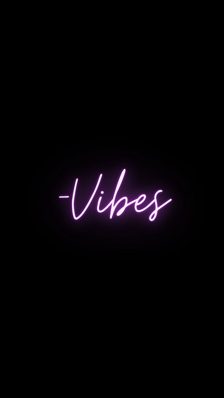 a neon sign that says vibes in the middle of it's dark background