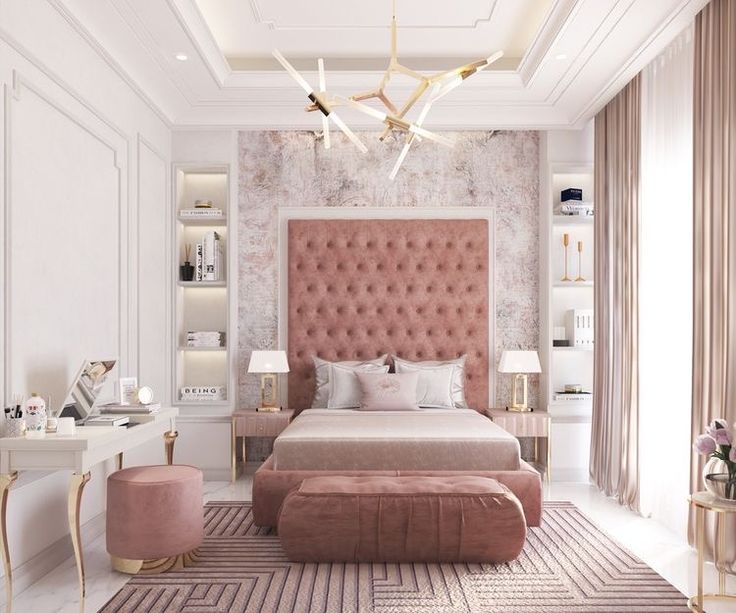 a bedroom with a pink headboard and gold accents on the walls, along with an ottoman