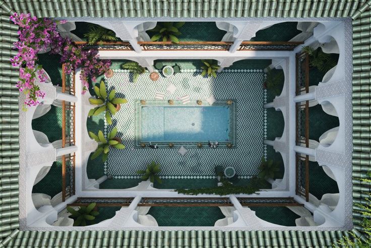 an aerial view of a swimming pool surrounded by plants and trees in the middle of a tiled floor