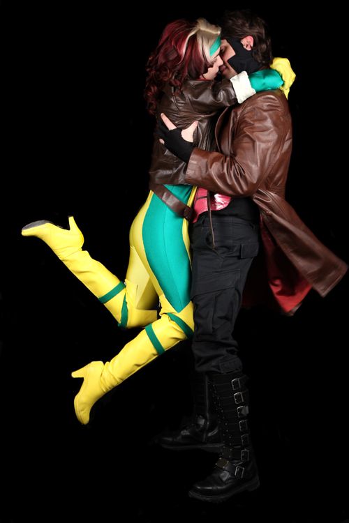 a man and woman dressed in costumes hugging