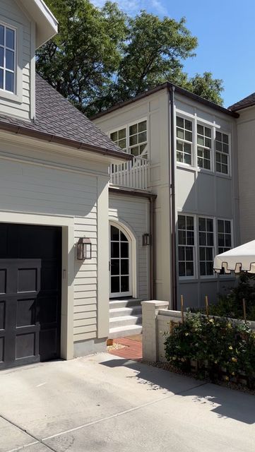 a house with two garages and an umbrella