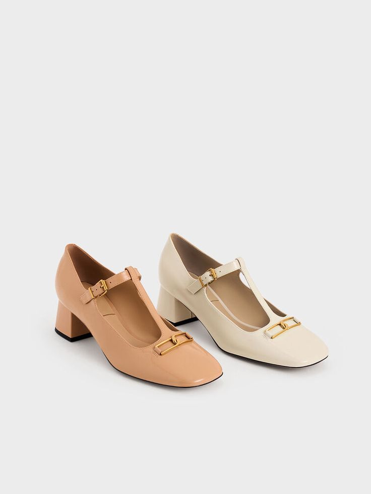 Putting together classic elements that have stood the test of time, these Mary Jane pumps are timelessly chic. The Mary Jane style features a T-bar design on the vamps for a nostalgic yet refreshing combination. In versatile nude, the supple leather construction lends these pumps an air of effortless sophistication. As a distinctive detail, interlocking Gabine buckles add shine while keeping the silhouette minimal. Raised on low block heels, these pumps will lengthen your frame and go well with flowy skirts and dresses. Flowy Skirts, Skirts And Dresses, Mary Jane Pumps, Charles Keith, Low Block Heels, Flowy Skirt, And Dresses, The Vamps, Bar Design