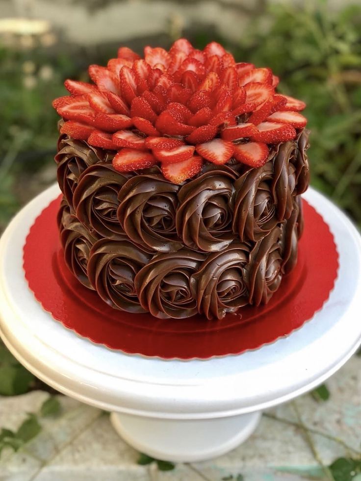 a chocolate cake with strawberries on top