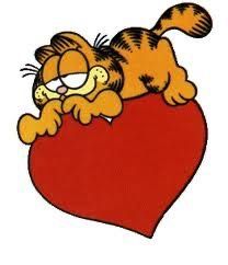 a cartoon cat laying on top of a heart with its paws in it's mouth