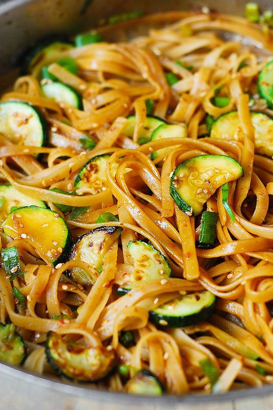 noodles with zucchini and sauce in a pan