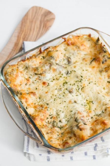 a casserole dish with broccoli and cheese