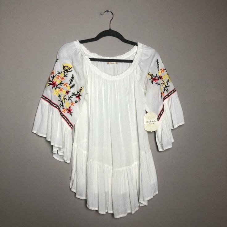 Brand New W/ Tags White And Flowy Embroidered Floral Designs On The Sleeves Super Cute And Chic Size M/L Y Summer Long Sleeve Top With Floral Embroidery, Embroidered Off White Summer Tops, Off White Embroidered Summer Tops, Bohemian Off White Top With Floral Embroidery, Embroidered Off White Tops For Spring, Off White Embroidered Top For Spring, White Embroidered Sleeve Summer Tops, White Embroidered Floral Top For Vacation, White Embroidered Floral Top For Summer