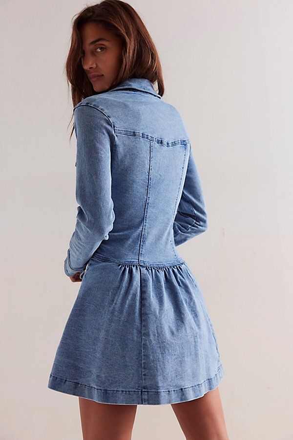 An elevated take on the classic denim dress, this mini is featured in a flattering drop-waist silhouette and long-sleeve style with a flouncy skirt and button-front closures. **Fit:** Fitted bodice, relaxed skirt, A-line hem **Features:** Soft cotton denim with a stretchy feel, collared-neckline, button-front closures, chest-pocket detailing, defined seams throughout, flared skirt, cuffed long-sleeves **Why We ❤ It:** This denim mini is perfect for pulling on no matter the season. | Roadhouse Mi Chic Washed Long Sleeve Denim Dress, Long Sleeve Washed Denim Dress For Work, Fitted Long Sleeve Denim Dress With Pockets, Fitted Long Sleeve Denim Dress With Button Closure, Fitted Long Sleeve Denim Dress For Work, Long Sleeve Cotton Mini Dress With Ruffle Hem, Cotton Long Sleeve Mini Dress With Ruffle Hem, Chic Long Sleeve Medium Wash Denim Dress, Chic Long Sleeve Denim Dress With Buttons