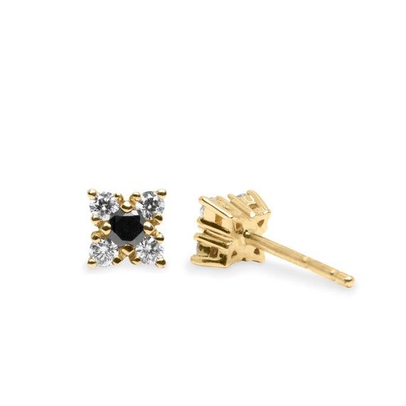 The Mini Eliana earrings are the perfect earrings. The sweet flowers are chic in black and white, or any other combination of colors. They will give you a perfectly polished look.The earrings are sold as singles and will look great with any earring you have in your own jewelry box or other single earrings from our collectionsMaterial: 14K or 18K GoldGemstone: DiamondsMeasurements: 1 black diamond 2mm , 4 white diamonds 1.5mm eachAverage Total Weight: 0.18 CaratAverage clarity and color: VS+F, BL Classic Black Diamond Earrings For Gift, Black Diamond Earrings Gift, Elegant Black Diamond Earrings For Gift, Black Diamond Earrings As Gift, Black Diamond Earrings For Anniversary, Gift Black Diamond Earrings, Black Diamond Cubic Zirconia Earrings As Gift, Elegant 14k Gold Earrings With Diamond Eyes, Unique Earring