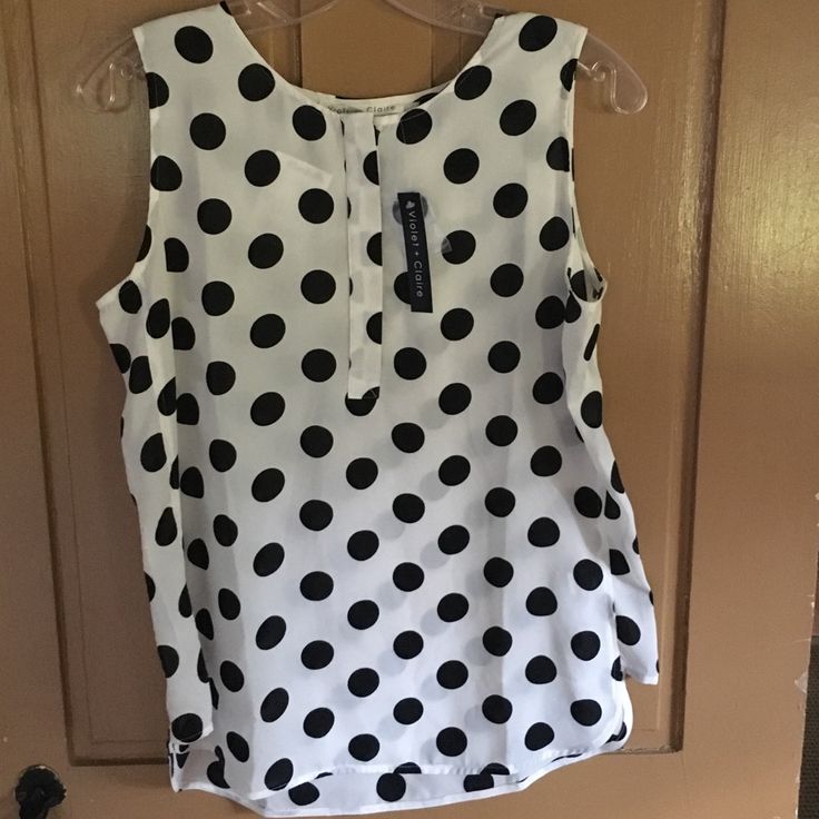 White Blouse W/Black Polka Dots. Sleeveless. New With Tags Casual Polka Dot Sleeveless Top, Fitted Polka Dot Sleeveless Blouse, Polka Dot Sleeveless Casual Blouse, Summer Sleeveless Polka Dot Blouse, Polka Dot Sleeveless Top For Work, Sleeveless Polka Dot Blouse For Summer, Casual Sleeveless Polka Dot Blouse, Sleeveless Polka Dot Top For Work, Polka Dot Sleeveless Blouse For Spring