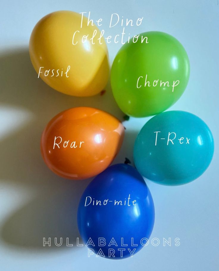 four balloons with different names on them sitting next to each other in front of a white background