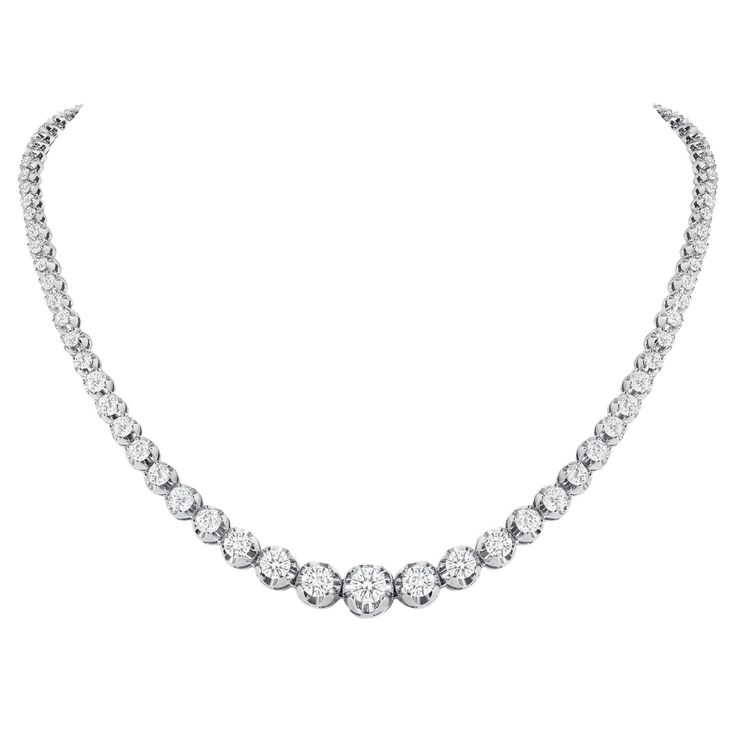 This finely made graduated necklace with beautiful round diamonds sits elegantly on any neck. Metal: 14k Gold Diamond Cut: Round Total Diamond Approx. Carats: 10ct Diamond Clarity: VS Diamond Color: F-G Size: 16 inches Color: White Gold Included with your order: Certificate of Appraisal Customized Necklace Box & Bag Customized Necklace, Diamond Tennis Necklace, Vvs Diamond, Graduation Necklace, Vs Diamond, Tennis Necklace, Necklace Box, Station Necklace, American Diamond