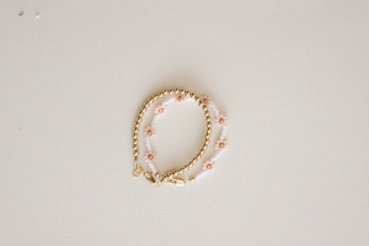 "This baby bracelet is made with high quality 14k gold filled beads, lobster clasp, and extender that won't tarnish and will resist wear and tear. We highly recommend measuring your babies wrist for the best fit. Take a measuring tape and measure wrist tightly around (in inches). Add 1/2 inch and that's the size you should order. Or you can leave measurement (tightly around) in special instructions for precision and I will take care of it! Each bracelet comes with extra links that extend 1/2 inc Hypoallergenic Dainty Rose Gold Beaded Bracelets, Dainty Yellow Gold Beaded Bracelets In 14k Gold Filled, Dainty Rose Gold Beaded Bracelets For Everyday, Dainty Rose Gold Beaded Bracelet For Everyday, Dainty Rose Gold Beaded Bracelet, Dainty Rose Gold Beaded Bracelets, Adjustable Delicate 14k Gold Beaded Bracelet, Delicate Adjustable 14k Gold Beaded Bracelet, Delicate 14k Gold-filled Bracelets With Gold Beads