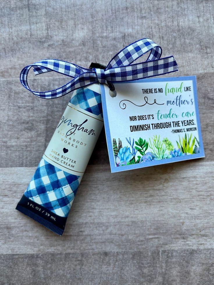 a tube of toothpaste tied with a blue gingham checkered ribbon