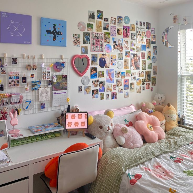 a bed with lots of stuffed animals on top of it next to a desk and window